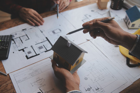 Engineer Teamwork Meeting, Drawing working on blueprint meeting for project working with partner on...