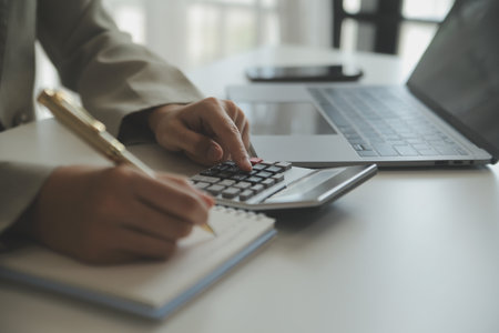 Businesswoman or accountant working Financial investment on calculator, calculate, analyze business...