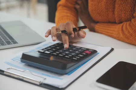 Businesswoman or accountant working Financial investment on calculator, calculate, analyze business...