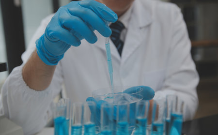 Scientist or medical in lab coat working in biotechnological laboratory, Microscope equipment for...