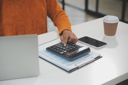 Businesswoman or accountant working Financial investment on calculator, calculate, analyze business...