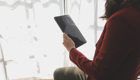 Financial Business woman analyze the graph of the company's performance to create profits and growth, Market research reports and income statistics, data,repotr,Financial and Accounting concept.の写真素材
