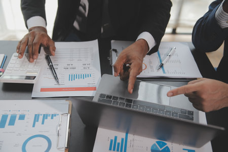 Financial Business woman analyze the graph of the company's performance to create profits and...