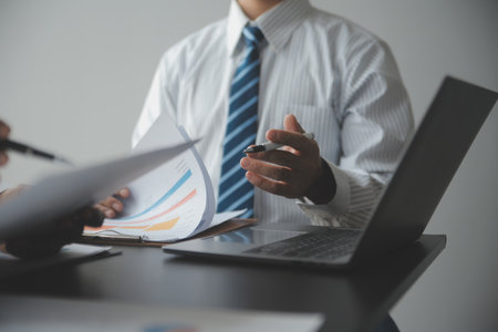 Financial Business woman analyze the graph of the company's performance to create profits and...