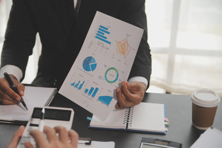 Team of business people working together in the meeting room office, teamwork background charts and graphs banner, double exposure successful teamwork,business planning concept.の写真素材