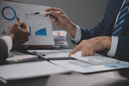 Team of business people working together in the meeting room office, teamwork background charts and graphs banner, double exposure successful teamwork,business planning concept.の写真素材