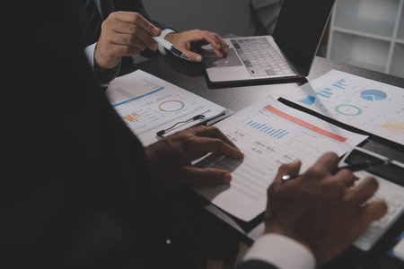Financial Business woman analyze the graph of the company's performance to create profits and...