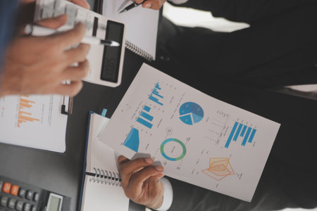 Team of business people working together in the meeting room office, teamwork background charts and graphs banner, double exposure successful teamwork,business planning concept.の写真素材