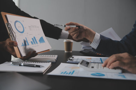 Team of business people working together in the meeting room office, teamwork background charts and graphs banner, double exposure successful teamwork,business planning concept.の写真素材