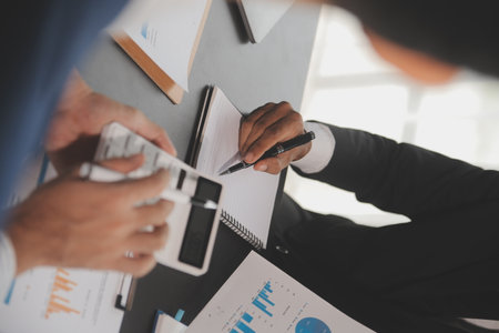 Team of business people working together in the meeting room office, teamwork background charts and graphs banner, double exposure successful teamwork,business planning concept.の写真素材