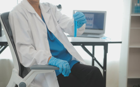 Health care researchers working in life science laboratory. Young female research scientist and...
