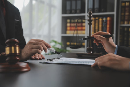 Customer service good cooperation, Consultation between a Businessman and Male lawyer or judge consult having team meeting with client, Law and Legal services concept.の写真素材