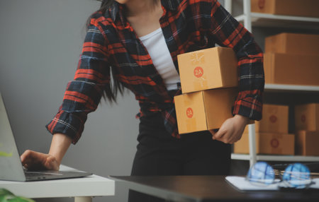 Business woman start up small business entrepreneur SME success .freelance woman working at home...