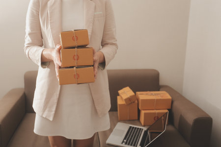 Business woman start up small business entrepreneur SME success .freelance woman working at home with Online Parcel delivery. SME and packaging deliveryconceptの写真素材