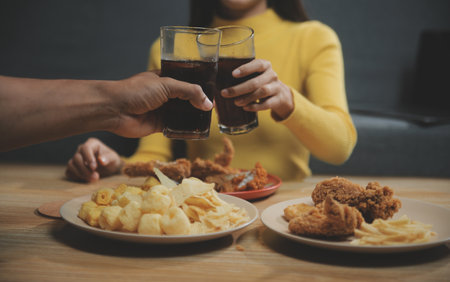 fat woman bite piece of pizza,overweight female is eating fast foods,asian girl is hungry