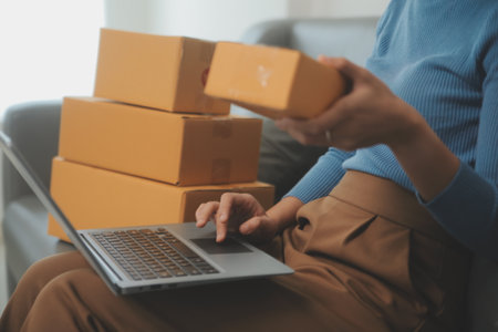 Business woman start up small business entrepreneur SME success .freelance woman working at home with Online Parcel delivery. SME and packaging deliveryconceptの写真素材