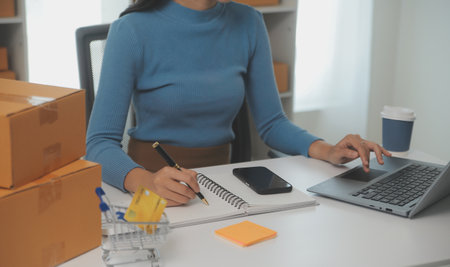 Business woman start up small business entrepreneur SME success .freelance woman working at home with Online Parcel delivery. SME and packaging deliveryconceptの写真素材