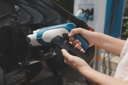 EV charging station for electric car in concept of green energy and eco power produced from sustainable source to supply to charger station in order to reduce CO2 emission .の写真素材