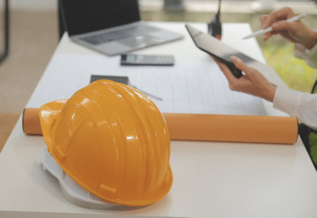 Engineer Teamwork Meeting, Drawing working on blueprint meeting for project working with partner on model building and engineering tools in working site, Construction and structure concept.の写真素材