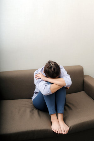 Sad, unhappy. Alone asian young woman, girl expression face thinking about problem, difficulty, feeling failure and exhausted, suffering from loneliness, grief sorrow and bad relationship or break up.の写真素材