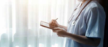 Doctor working with laptop computer in medical workspace office. doctor working on laptop computer in modern clinics office. search medical information. banner copy spaceの写真素材