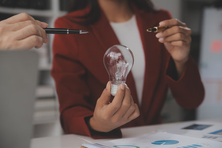 Inspiration. hand hold light bulb for good idea. brainstorming creative idea.の写真素材