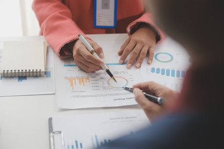 Close up Business woman using calculator and laptop for do math finance on wooden desk, tax, accounting, statistics and analytical research conceptの写真素材