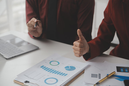 Close up Business woman using calculator and laptop for do math finance on wooden desk, tax, accounting, statistics and analytical research conceptの写真素材