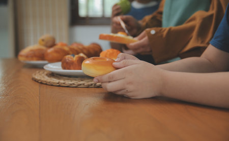 Caucasian attractive couple baking bakery with son in kitchen at home. Happy Family-father, mother...