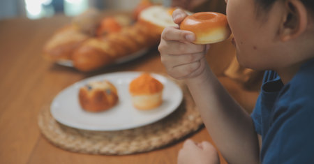 Caucasian attractive couple baking bakery with son in kitchen at home. Happy Family-father, mother and young boy having fun spending time together using ingredient making foods. Activity relationship.の写真素材