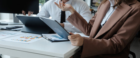 Business Documents, Auditor businesswoman checking searching document legal prepare paperwork or report for analysis TAX time,accountant Documents data contract partner deal in workplace officeの写真素材