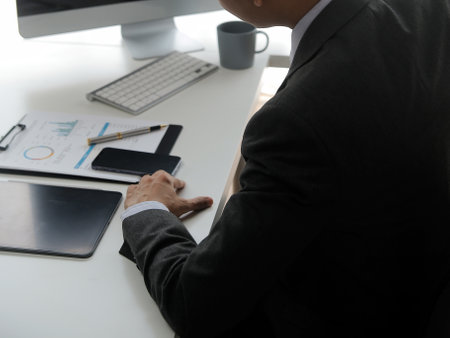 Close up Business woman using calculator and laptop for do math finance on wooden desk, tax, accounting, statistics and analytical research conceptの写真素材