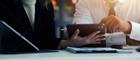 Close up of Business team analyzing income charts and graphs with modern laptop computer. Business analysis and strategy concept.の写真素材
