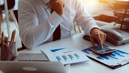 Close up of Business team analyzing income charts and graphs with modern laptop computer. Business analysis and strategy concept.の写真素材
