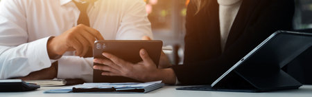 Close up of Business team analyzing income charts and graphs with modern laptop computer. Business...