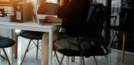 Close up of Business team analyzing income charts and graphs with modern laptop computer. Business analysis and strategy concept.の写真素材
