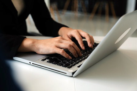 Close up of Business team analyzing income charts and graphs with modern laptop computer. Business analysis and strategy concept.の写真素材