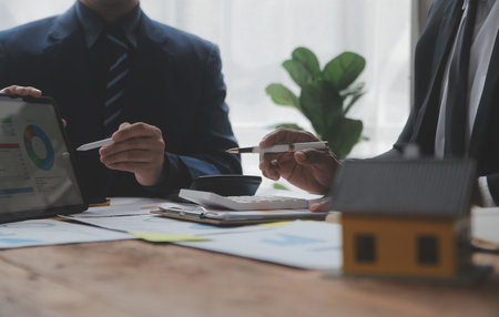 Team of business people working together in the meeting room office, teamwork background charts and graphs banner, double exposure successful teamwork,business planning concept.の写真素材