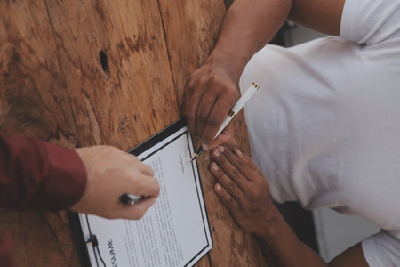 Close up view of job interview in office, focus on resume writing tips, employer reviewing good cv of prepared skilled applicant, recruiter considering application, hr manager making hiring decisionの写真素材