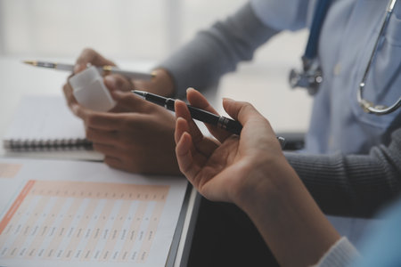 Doctors, nurse or laptop in night teamwork, medical research or surgery planning in wellness hospital. Talking, thinking or healthcare women on technology for collaboration help or life insurance appの写真素材