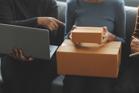Business woman start up small business entrepreneur SME success .freelance woman working at home with Online Parcel delivery. SME and packaging deliveryconceptの写真素材