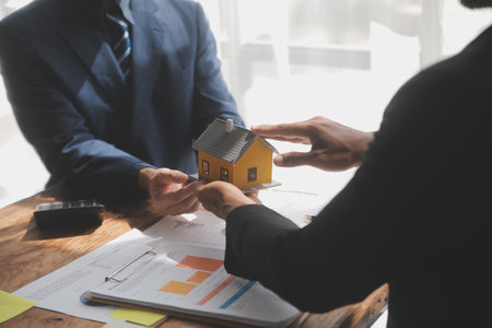 Real estate agent and customer signing contract to buy house, insurance or loan real estate.rent a house,get insurance or loan real estate or property.の写真素材