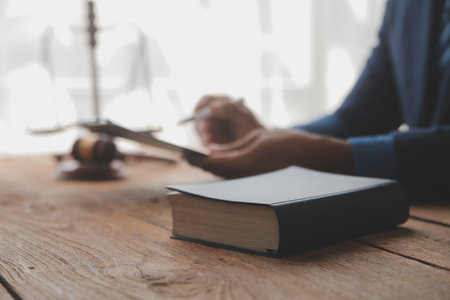 Justice and Law concept. Legal counsel presents to the client a signed contract with gavel and legal...