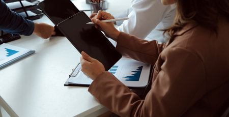 Team of business people working together in the meeting room office, teamwork background charts and...