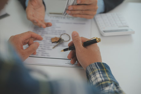 Real estate agent and customer signing contract to buy house, insurance or loan real estate.rent a...
