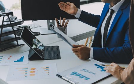 Team of business people working together in the meeting room office, teamwork background charts and graphs banner, double exposure successful teamwork,business planning concept.の写真素材