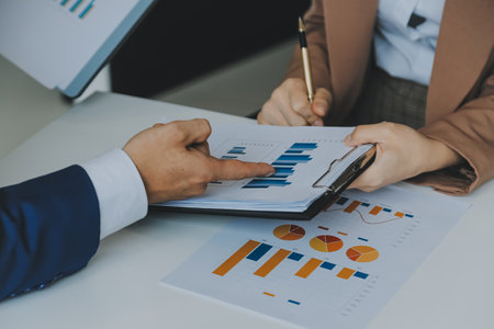 Team of business people working together in the meeting room office, teamwork background charts and graphs banner, double exposure successful teamwork,business planning concept.の写真素材