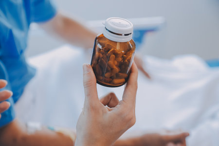 Women Asian doctors hold the patient hand and encourage and provide medical advice While checking the patient health in bed. Concept of Care and compassion, antenatal care, Threatened abortionの写真素材