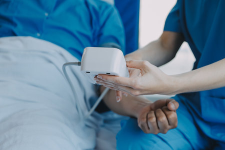 Women Asian doctors hold the patient hand and encourage and provide medical advice While checking the patient health in bed. Concept of Care and compassion, antenatal care, Threatened abortionの写真素材