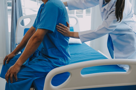 Women Asian doctors hold the patient hand and encourage and provide medical advice While checking the patient health in bed. Concept of Care and compassion, antenatal care, Threatened abortionの写真素材